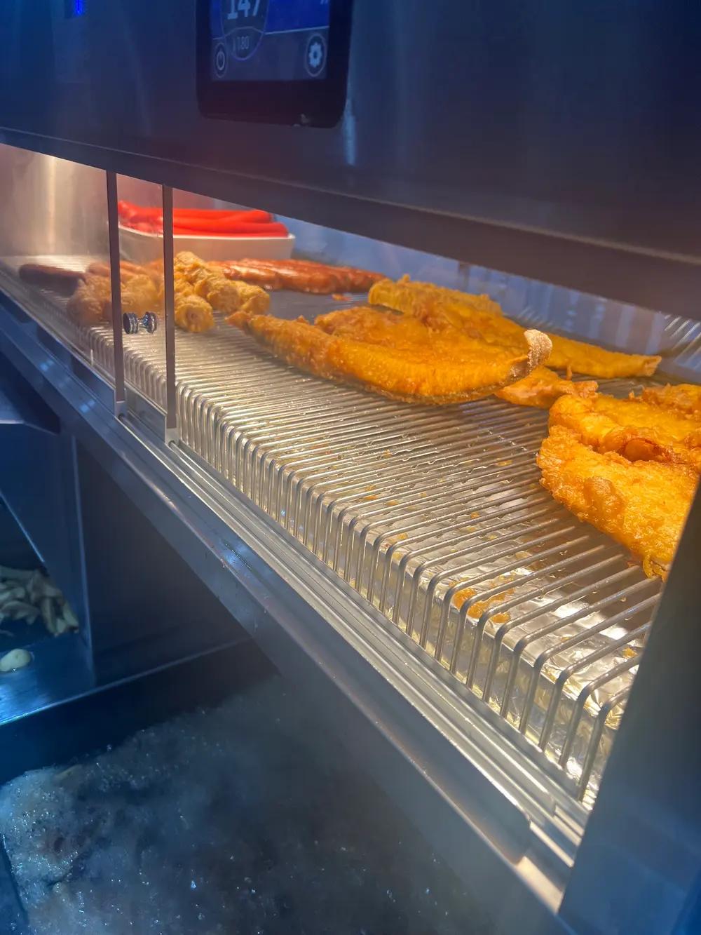 Fresh battered fish in the hot cabinet