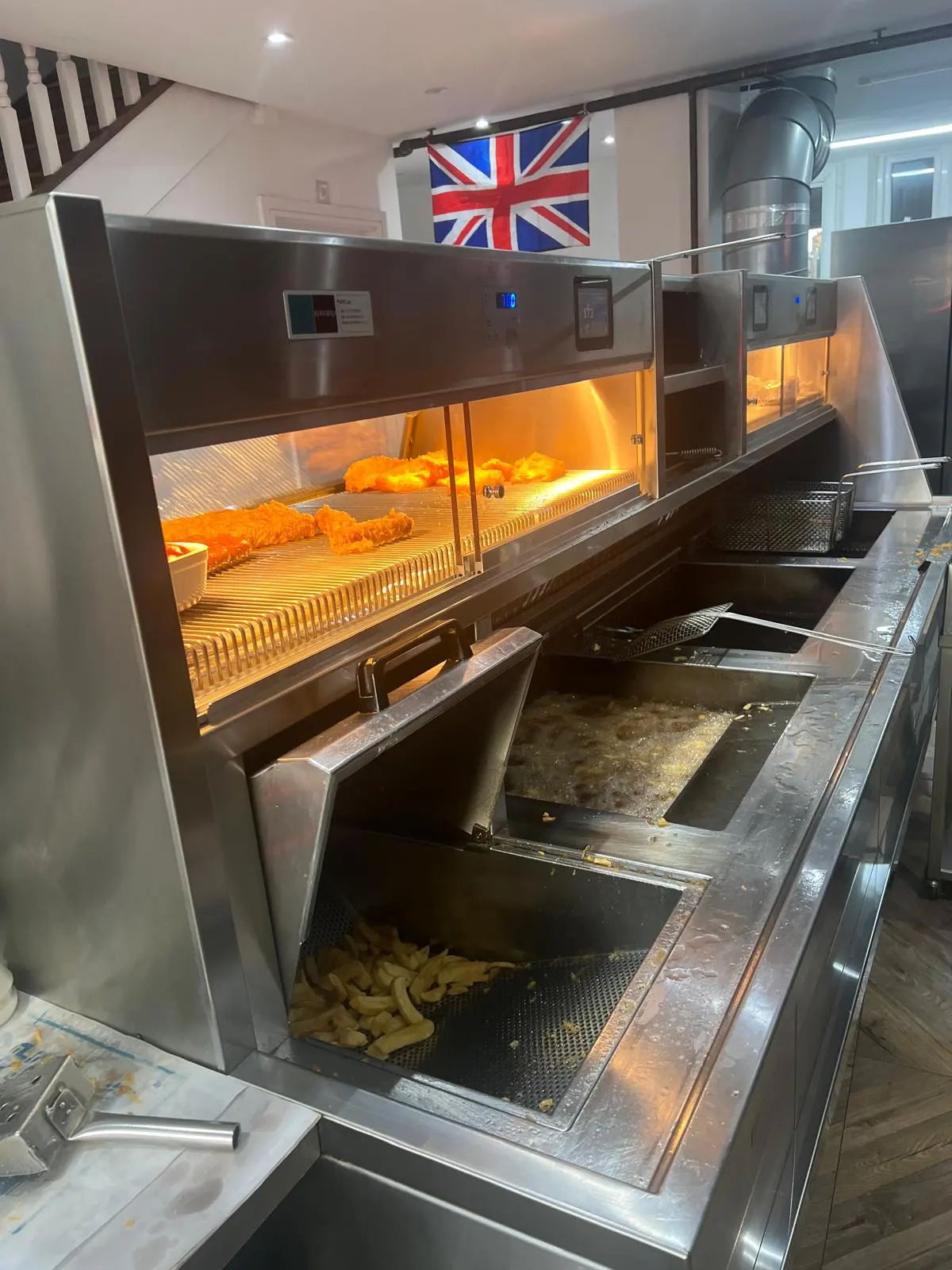 The new frying range inside Sea World with the Union Jack on the wall