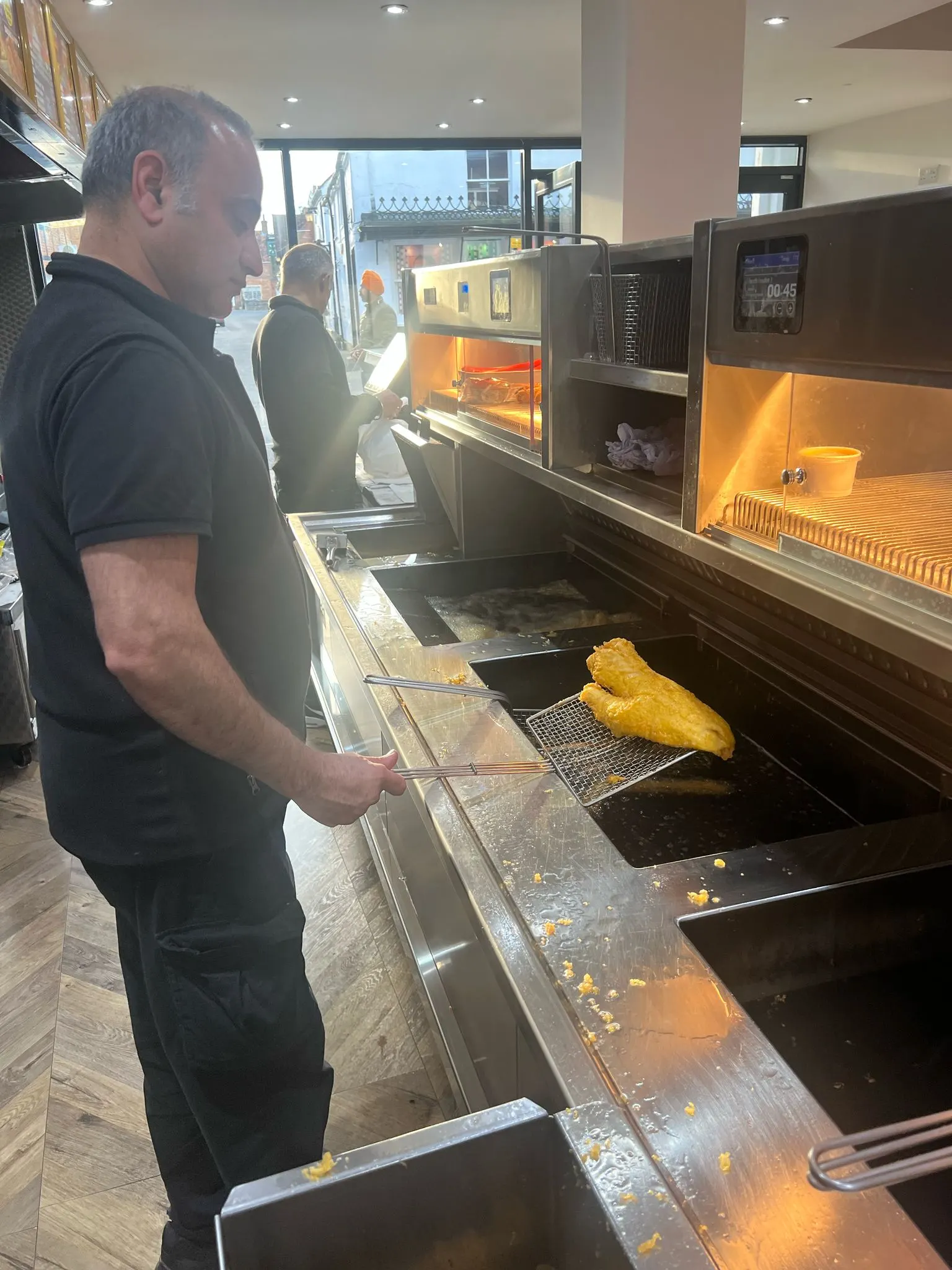 Tony frying fish at the Sea World range on Burnham High Street